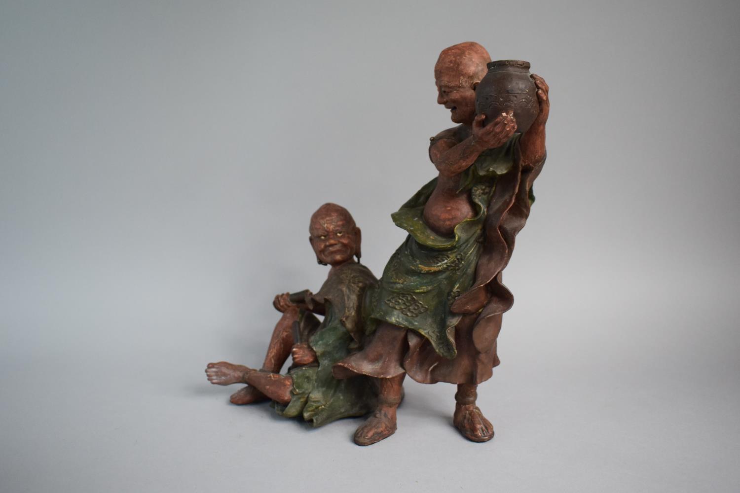 A Japanese Terracotta Figure Group, Monk Teasing Seated Scribe. 30.5cms High - Image 2 of 3