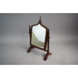 A Pretty 19th Century Mahogany Framed Small Dressing Table Mirror with Turned Supports and Shaped