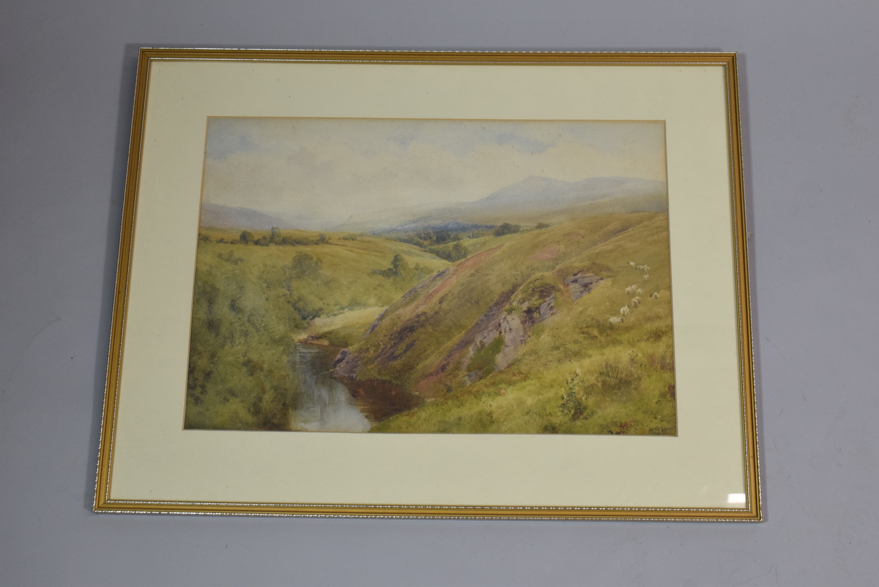 A Framed Watercolour of Welsh River Valley, Monogrammed For W. Eyre Walker. 45.5cm x 31.5cms