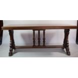 A Reproduction Regency Mahogany Library Table with Carved Border and Central Tri Spindle Vase