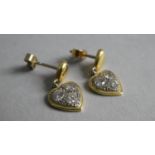 A Pair of 18ct Yellow Gold and Diamond Earrings. Heart Shaped Drops containing Three Diamonds.