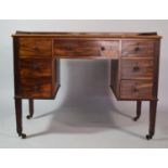 A 19th Century Mahogany Campaign Desk with Two Banks and Central Long Drawer. One Dummy Bank Opening