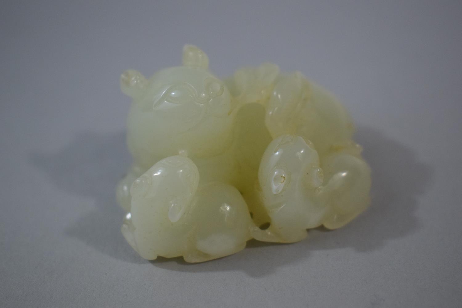 An Oriental Carved Jade Study of a Cat and Two Kittens, 5.2cms Long