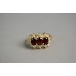 A 9ct Gold, Diamond and Garnet Cluster Ring, 4.1gms.