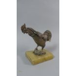 An Early 20th Century Table Top Vesta Case Modelled as a Strutting Cockerel, Mounted on an Alabaster