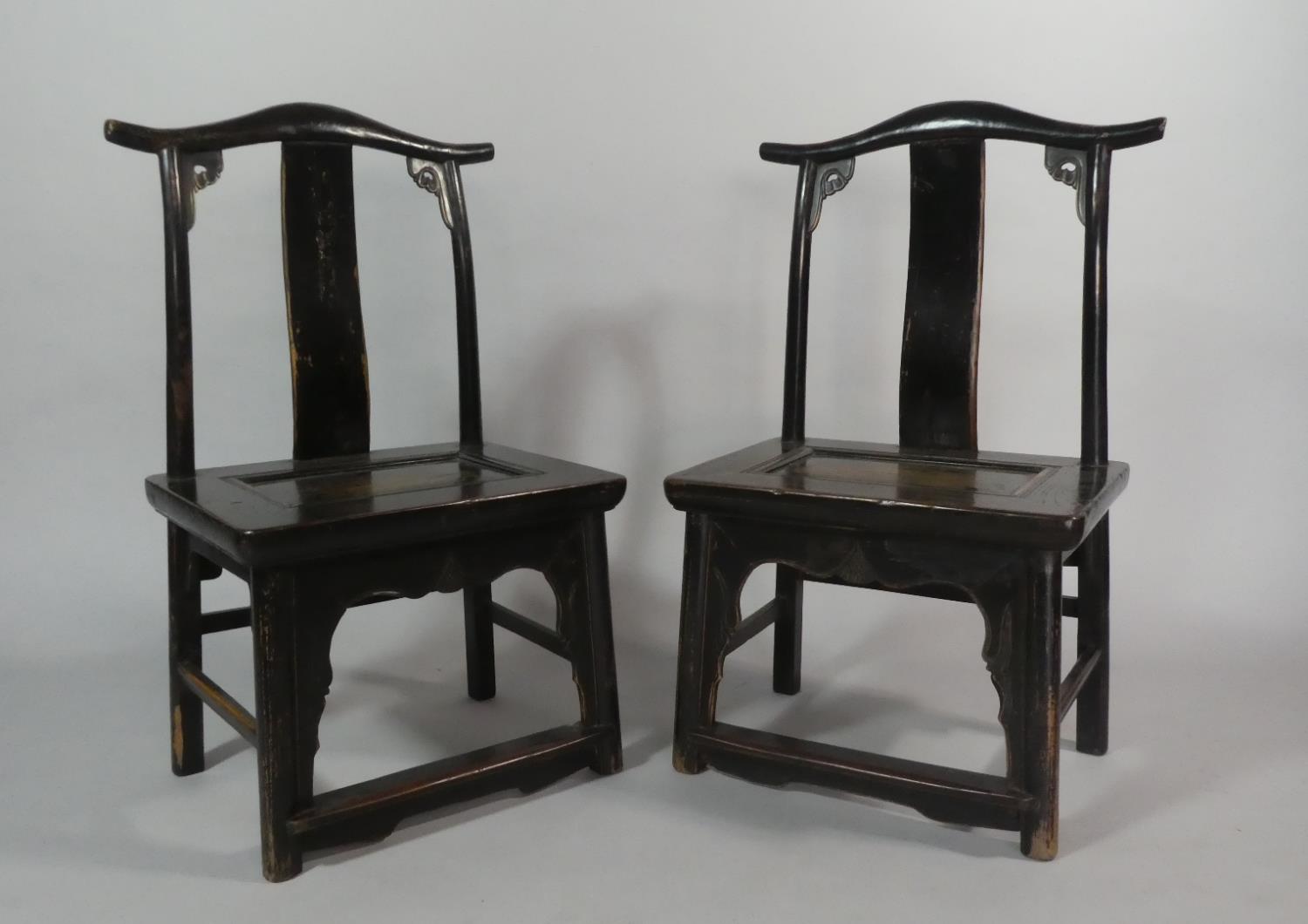 A Pair of 19th Century Ebonised Chinese Scholar's Chairs of Ming Design.