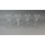 A Collection of Four Cut Glass Candle Sticks
