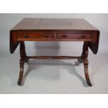 A Mahogany Sofa Table with Two Short Drawers having Carved Decoration, Set on Lyre Supports with