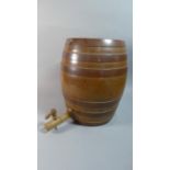 A Treacle Glazed Ceramic Barrel with Wooden Tap, 37cm high