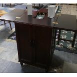 A Modern Mahogany Music Cabinet Housing CD Player Together with a Collection of CD's