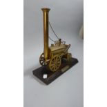 A Brass Model of Stephenson's Rocket on Wooden Plinth, 23cm Wide