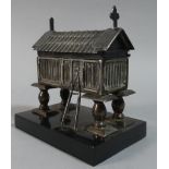 An Oriental White Metal Novelty Box in the Form of a Granary Raised on Four Stilts, Ebonised