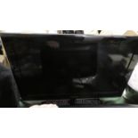 A Samsung 30" Flat Screen TV with Remote