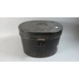 A Late 19th Century Black Painted Oval Hat Tin