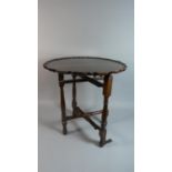 An Edwardian Folding Mahogany Table, 50cm Wide