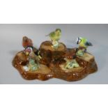 A Beswick Tree Stump Stand and Five Beswick Birds, Robin's Beak AF