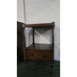 An Edwardian Mahogany Galleried Two Tier Trolley with Turned Supports and Base Drawer, 47cm Wide