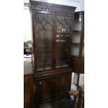 A Mid 20th Century Mahogany Glazed Bookcase with Two Adjustable Shelves and Cupboard Base, 76cm Wide