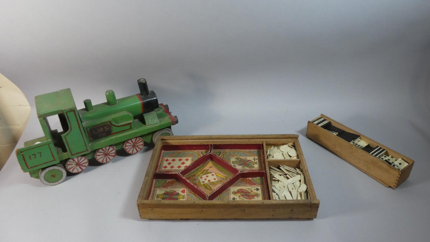 A Handmade Wooden Model of an LMS Locomotive, 39cm Long a Wooden Box Containing Dominoes and a