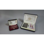 A Cased Set of Orient Express Playing Cards and Cased Set of Four Sterling Silver Bridge Pencils
