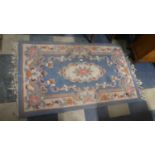 A Chinese Woollen Hearth Rug on Blue Ground, 153cm x 92cm