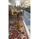 A Mid 19th Century Mahogany Jardiniere Stand with Circular Marble Inset Top, Elongated Vase