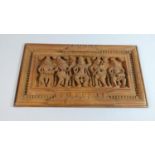 An Indian Moulded Wood Effect Panel Depicting Hindu Musicians and Dancer, 41cm Wide