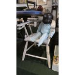 A White Painted Child's Commode Chair and Black Faced Doll