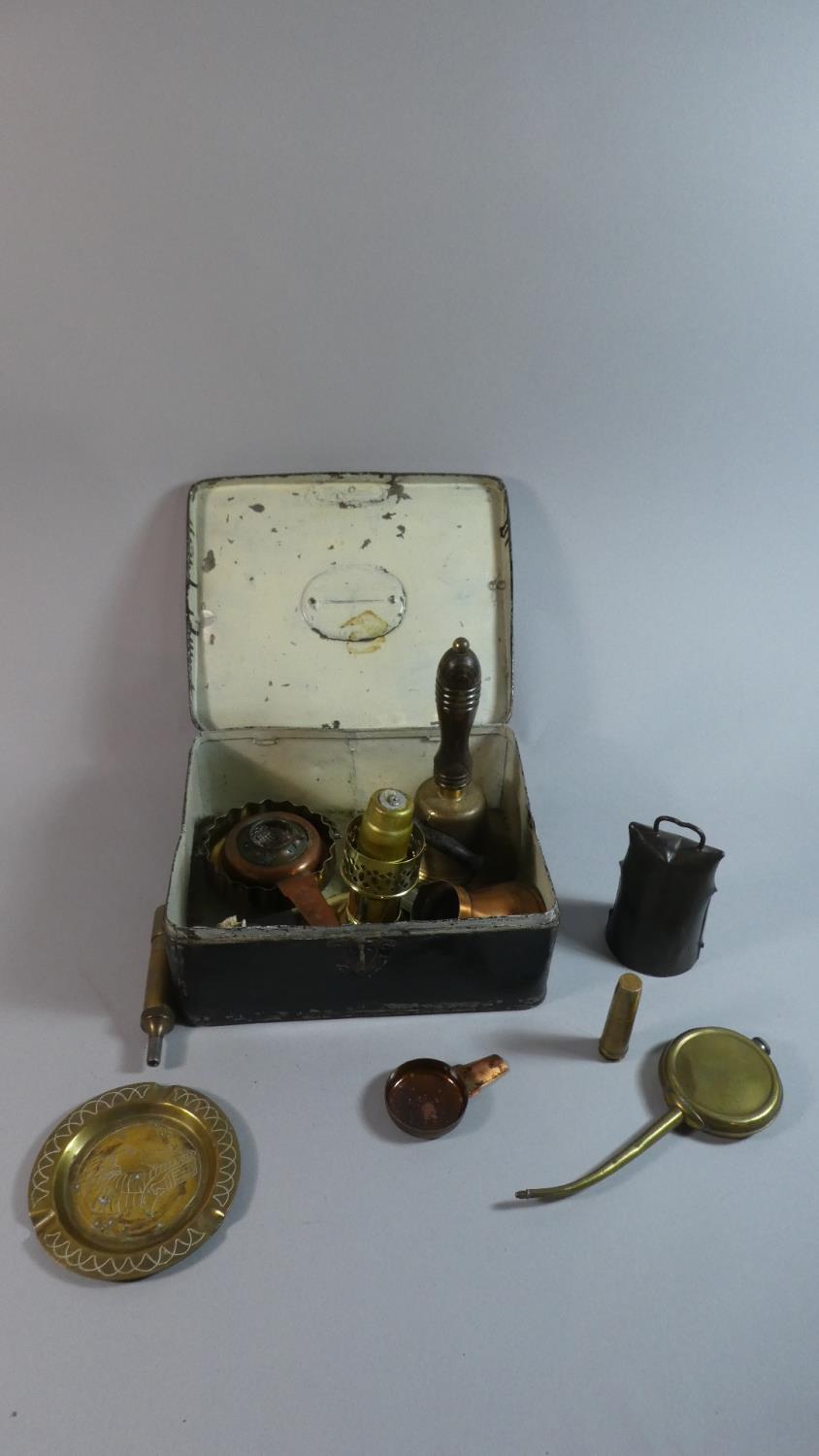 A Vintage Tin Containing Brass Handbell, Cowbell, Copperwares, Lamps and Candle Stands etc