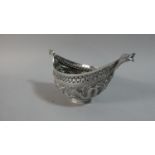 A Chinese White Metal Boat Shaped Bowl with Pierced Rim and Repousse Work Decoration Depicting