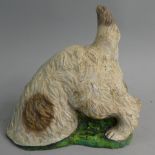 A Cast Reconstituted Stone Garden Ornament in the Form of a Terrier Disappearing Down Rabbit Hole,