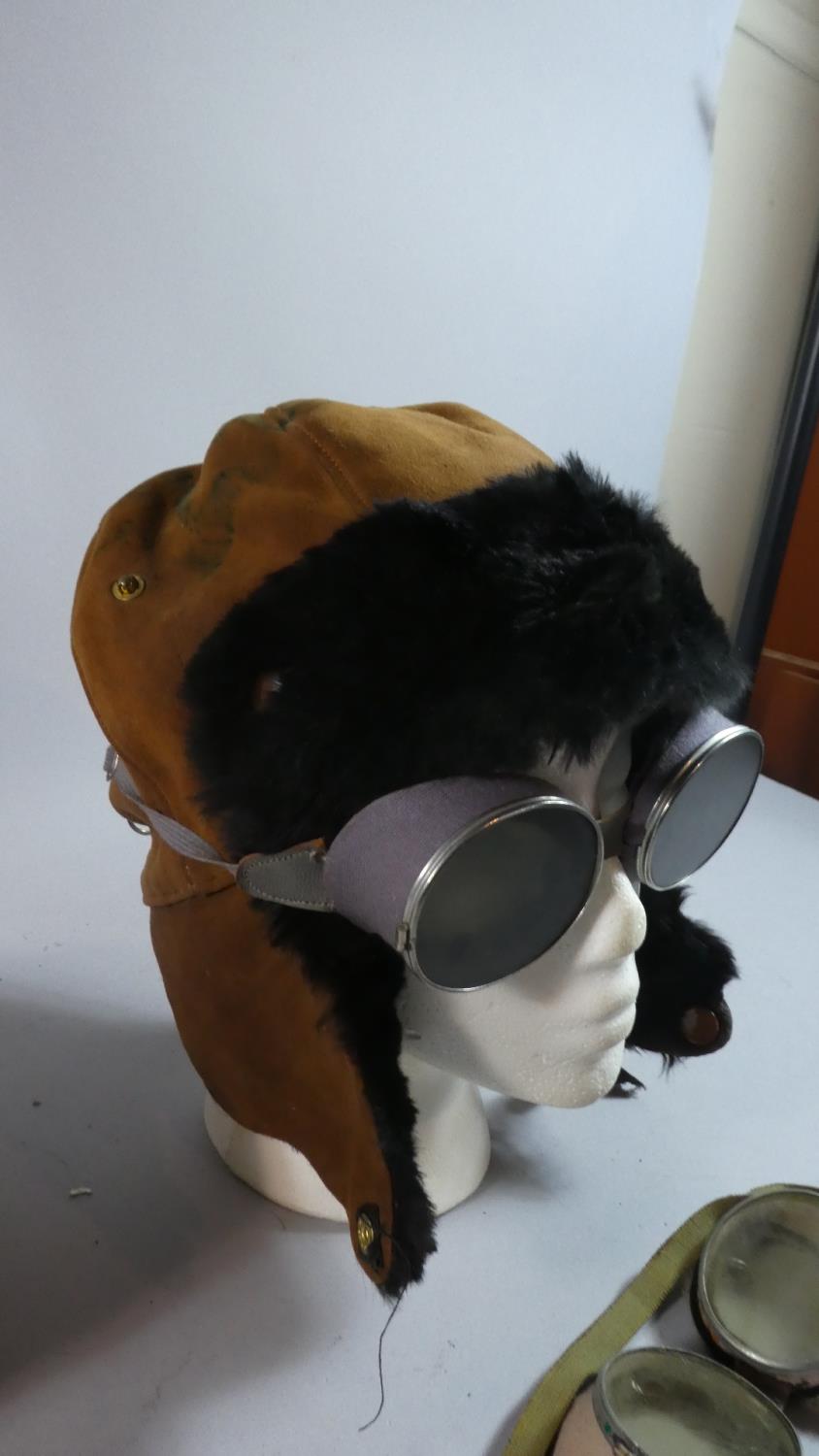 A Circular Leather Collar Box Containing Vintage Driving Goggles and Hat - Image 2 of 3