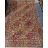 A Patterned Woollen Rug, 236cm x 137cm