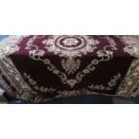 A Large Patterned Throw on Maroon Ground, 187cm Wide