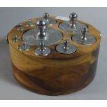 A Graduated Set of Ten Continental Chromed Scale Weights Set in Circular Wooden Stand, 13cm high
