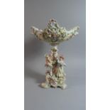 A Continental Floral Encrusted Basket on Figural Stand, Restored 40cm high