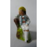 A Miniature Staffordshire Figure of a Seated Gent, 2.5cm High
