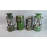 A Pair of Green Enamelled Hurricane Lamps, a Smaller Example and Cylindrical Flask