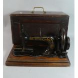 A Cased Singer Sewing Machine