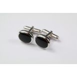 A Pair of Silver and Onyx Dress Cufflinks