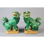 A Pair of Antique Emerald-Green Ceramic Kylins