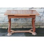 An Arts and Crafts Style Oak Dining Table.