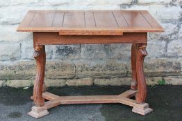 An Arts and Crafts Style Oak Dining Table.