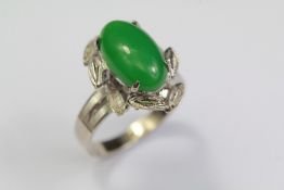 An 18ct White Gold and Apple Green Jade Ring