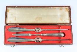 A Set of Silver Seafood Forks and Scoop