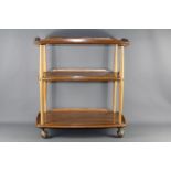 An Ercol Light Oak Tea Trolley