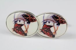 A Pair of Silver and Enamel Cuff Links