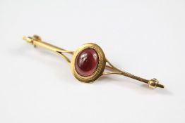 A Gentleman's 9ct Gold Cabochon Garnet Stock Pin