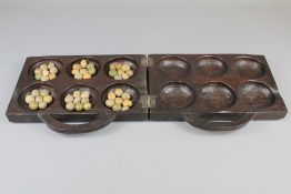 An African Mancala/Oware Board Game