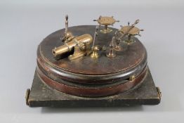 A Georgian Mahogany and Bronze Miniature Desk Cannon